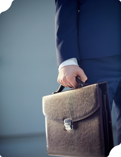 A person in a suit holding a briefcase